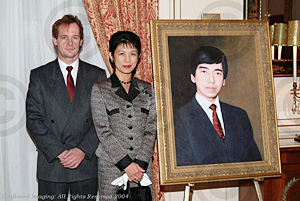 Photo of Princess Takamado and Ted Colyer next to a portrait of Prince Takamado by Ted Colyer.